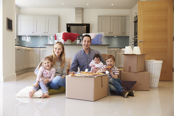 Large family in their new home posing for this picture 