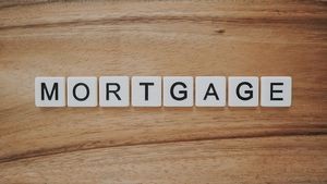 Scrabble blocks that spell mortgage.