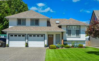 Nice split entry home with a two car garage and a paved driveway