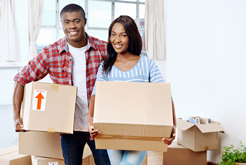 Happy Philly home buyers moving boxes